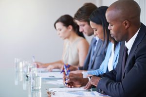 business, people and water in boardroom with paper for writing notes in finance meeting. corporate lawyers, documents and conference for stakeholders, strategy and planning company growth in office