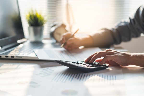 tax deduction planning concept. businessman calculating business