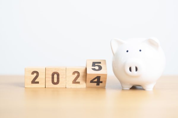 2024 end year to happy new year 2025 with piggy bank. resolution, goals, plan, action, money saving, retirement fund, pension, investment and financial concept