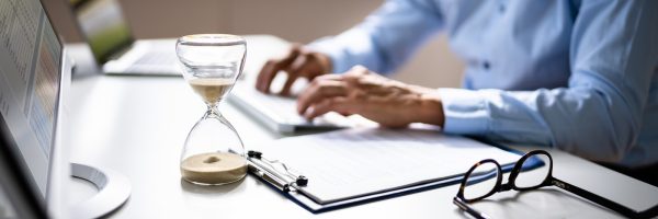 late invoice and billing deadline with hourglass