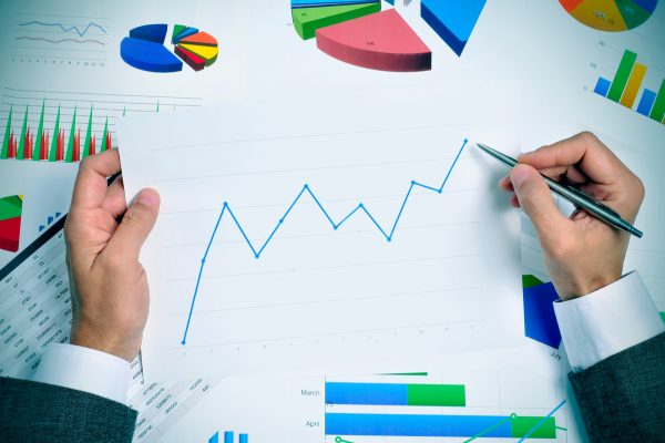 businessman observing a chart with an upward trend