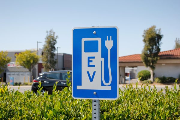 a view of a city sign and symbol for electric vehicle parking an