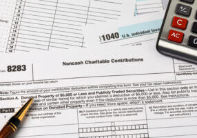 noncash charitable contribution tax form. charity donation, deduction and income tax return concept.