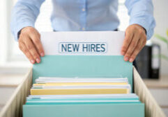 new hires folder in human resources recruitment office showing organized employee documents for smooth onboarding process