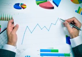 businessman observing a chart with an upward trend