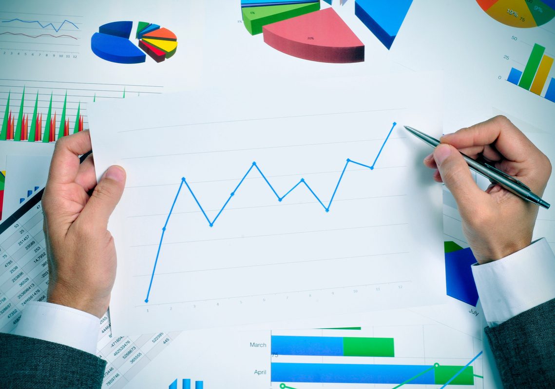 businessman observing a chart with an upward trend